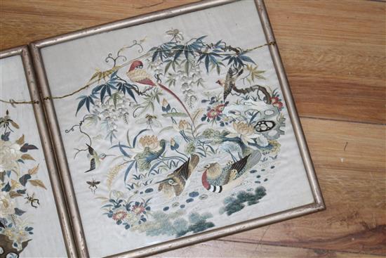 A set of four Chinese silkwork panels depicting birds and flowers, housed back to back in two frames, c.1910, 26.5 x 27cm